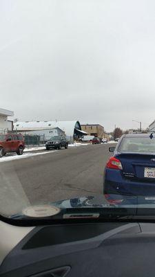 The white curved building on the left is the studio space