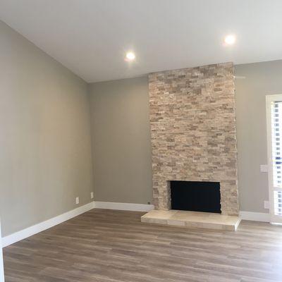 Fireplace stone, flooring, can lights and paint