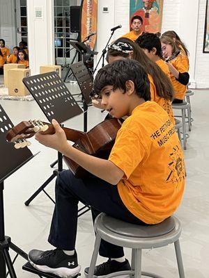 Students part of the Petty-Drayton Beginner Guitar performing at the fall semester Student Concert