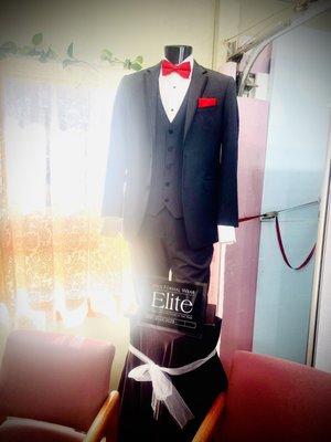 Formal black suit with red bow tie