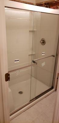 Shower insert and glass shower doors installation