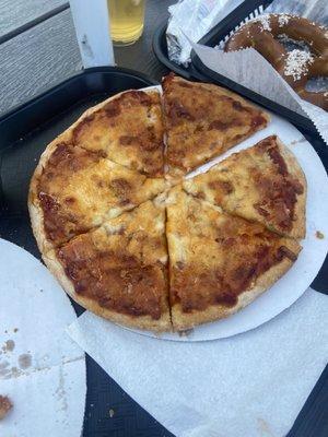 Burnt cheese pizza covered in honey