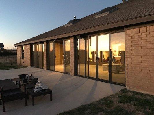 After photo, installation of three bi-parting patio doors