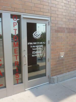 The main entrance (middle doors) to Optimal Family Eye Care's office located at Super Target.