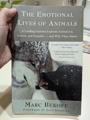 A photo of a book titled The Emotional Lives of Animals by Marc Bekoff.