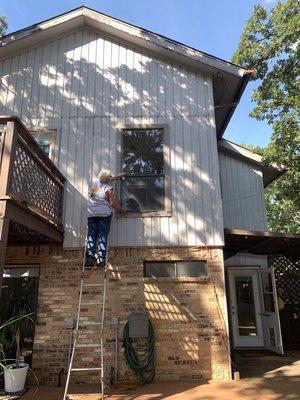 This is the master bedroom window about to be installed. Steve is taking off the screen.