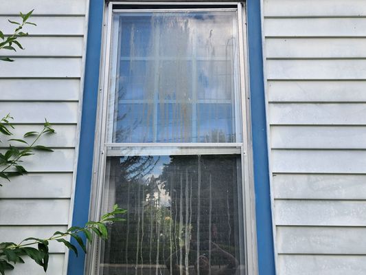 As you can see a dirty window that plum point construction Stated he pressure washed.