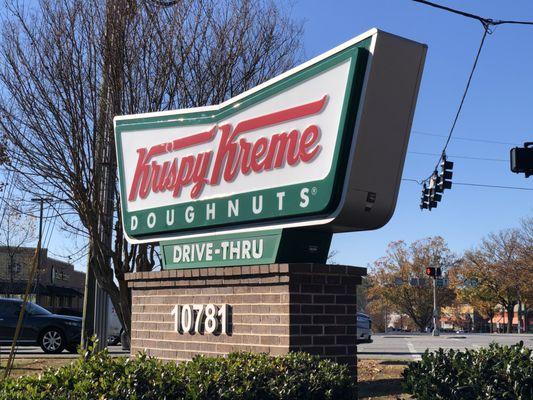 Krispy Kreme sign on the corner.