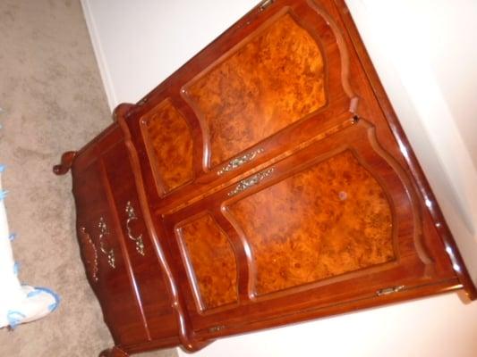 Large armoire with gouges and scrapes on the side.  Touch up to match color after proper repair of the gouges. Damage shown in below