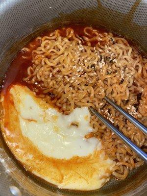 The Samyung Buldak Original Fire Noodles  with mozzarella on the side