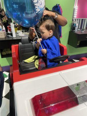 Haircut with balloon and lollipop