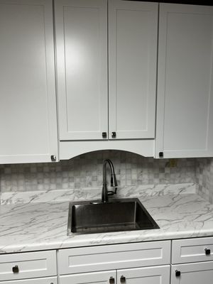 Tile backsplash, cabinets, sink and countertop replacement