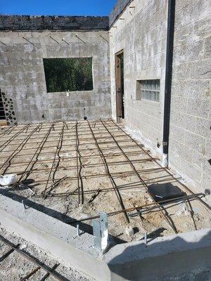 Structural slab epoxy connection at structural masonry foundation and wall assembly