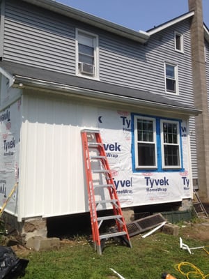 After porch redo- new windows, vertical batten board siding