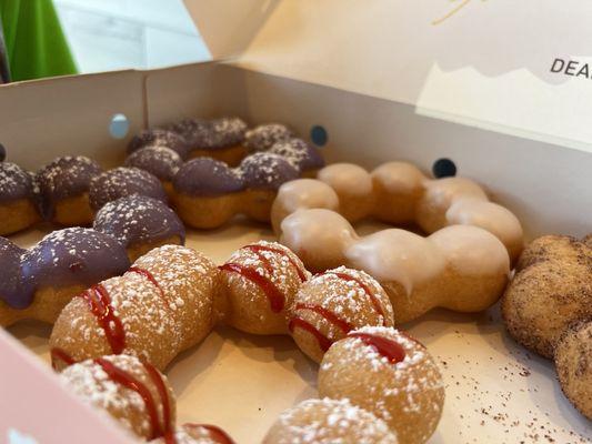 Got hungry. Ube, raspberry funnel, original glazed, and chocolate churro.