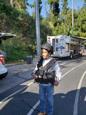 My grandson with the ballistic vest & helmet