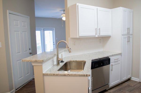 Updated faucet, sink, cabinets, countertops and appliances.