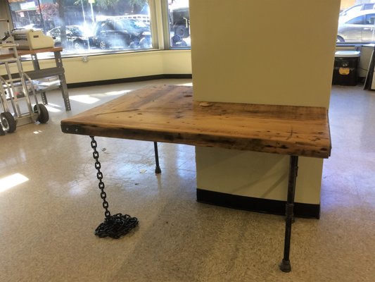 Our show room and work space is coming along nicely. Lap top table reclaimed wood recycled pipes and chain, We LOVE IT!