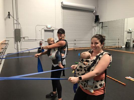 Baby-wearing mamas getting in shape in our fitness class