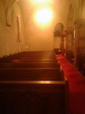 Side chapel showcasing the gorgeous and historic architecture of the building.