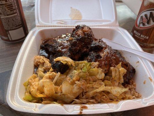 Jerk Chicken with rice and cabbage.