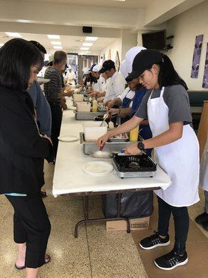 High School Culinary Program students making omelettes