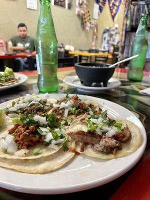 Four tacos: Pastor, Carnitas, Asada