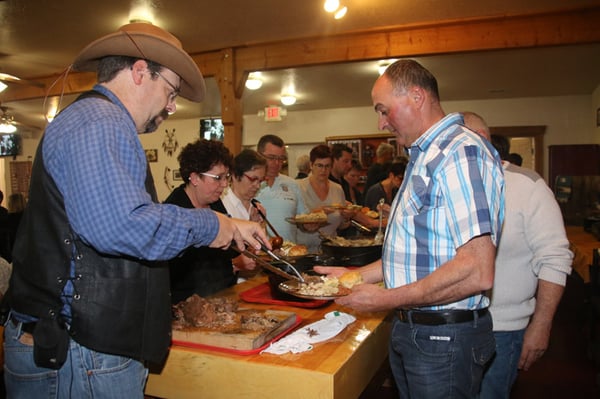 Hand carved slow roasted beef being served to a bus tour customer by Jason, our Dining Room Manager