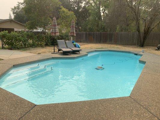 Completed/resurfaced pool with water