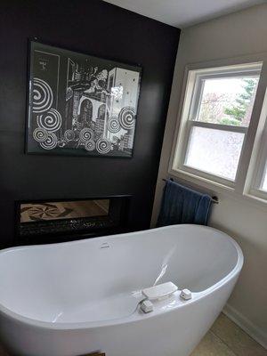 Soaker tub with see-thru fireplace