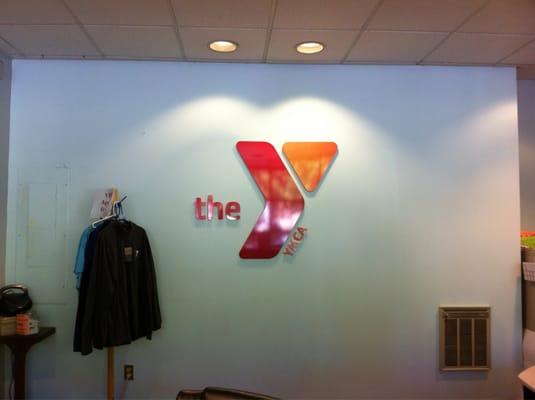 YMCA Logo behind the front desk