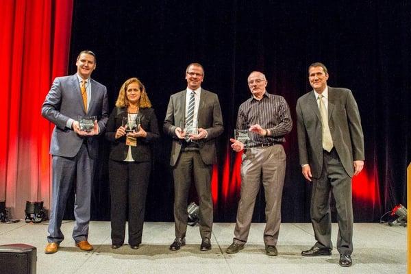 Our CEO accepting our "Oregon 100 Best Places to Work for" Hall of Fame award