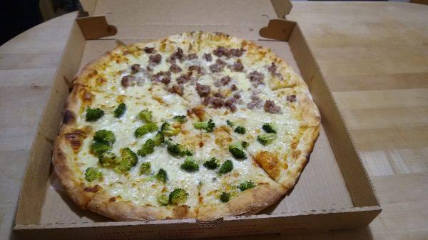 Half broccoli half sausage garlic pizza