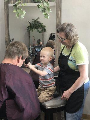 Daddy and son bonding moment. Plus dad gets his hair cut.