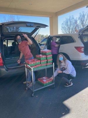 Sending off shoeboxes filled with toys for children in need.