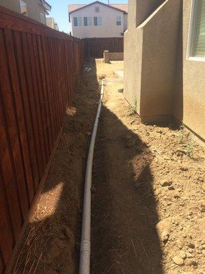 Unfinished backyard drainage system