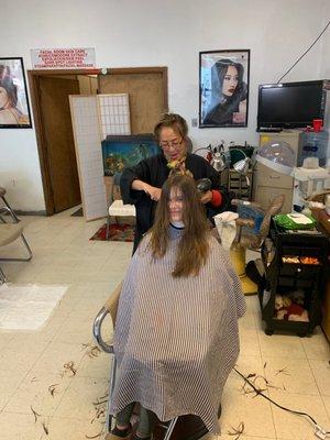 Salon Proprietor Linda doing Leila's hair.