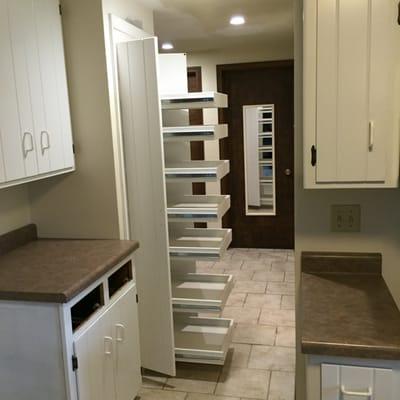 Installed food pantry with pull out drawers