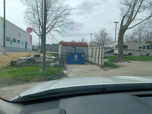 Piles of trash and garbage in parking lot