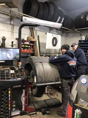 J and Tim getting some tires done