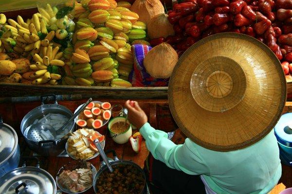 Damnoen Saduak Floating Market in Bangkok is a must when in Thailand.