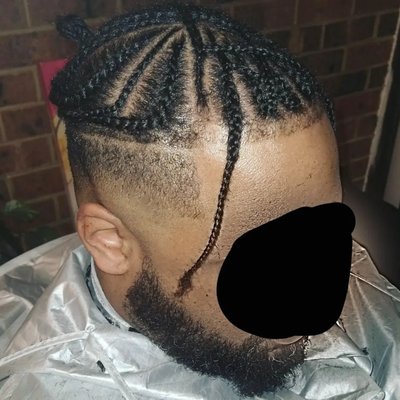 High drop fade and trimmed part, under braids