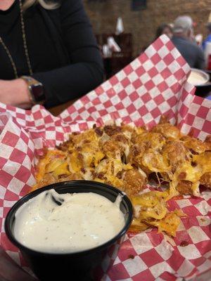 LOADED tots that stuck together like glue. The checkered picnic paper stuck to the gluey tots like well glue.