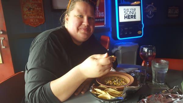 My wife getting ready to dive into some white chili.