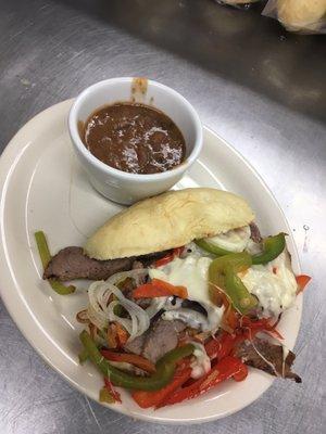 Philly cheesesteak with homemade roll and local beef and cowboy beans made with local beans!