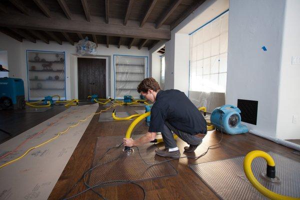 Drying out wood floors after a  water damage.