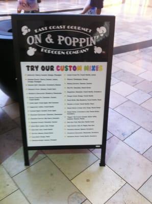 The On & Poppin' display board next to Starbucks downstairs in the Avenues mall that leads you to the shop!