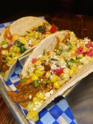 Dos Pollo - Grilled chicken tacos on corn tortillas with grilled corn salsa and avocado crema