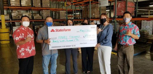 State Farm Agent Larry Welsch and other Agents made donations totaling $27,000 to help the local Hawaii Foodbank