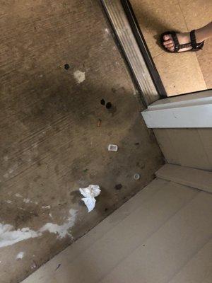 Cigarette butts, glass, nails and screws, used tissue, gum and bottle caps found outside our door.